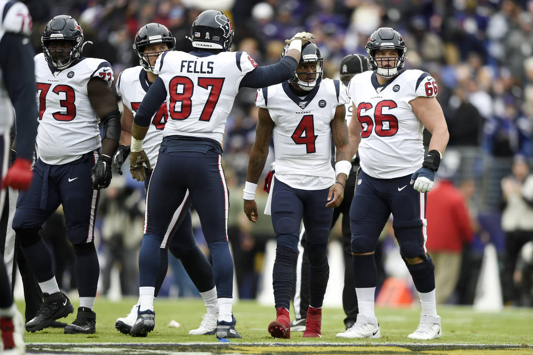 Houston Texans tight end Darren Fells (87) taps quarterback Deshaun Watson (4) after Watson los ...