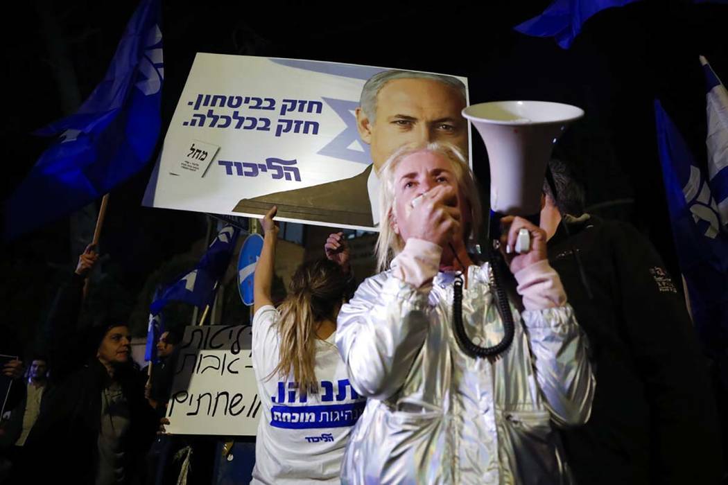 Supporters of Israeli Prime Minister Benjamin Netanyahu gather outside his residence in Jerusal ...