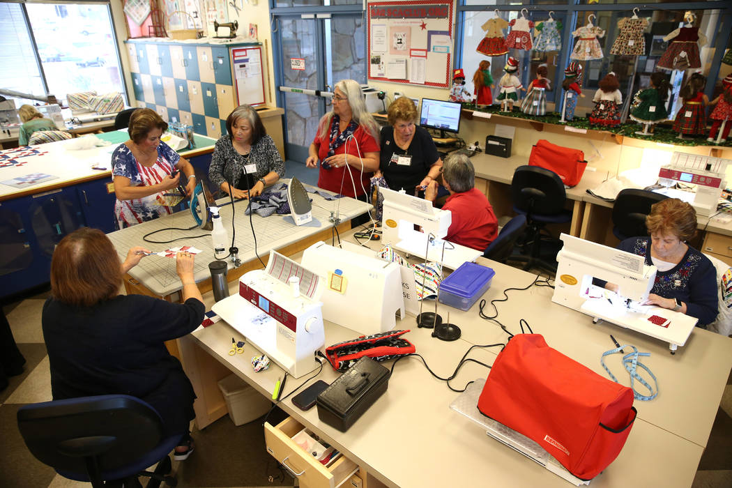 Members of Quilters for Veterans meet to make patriotic-themed quilts for veterans, at the Sun ...