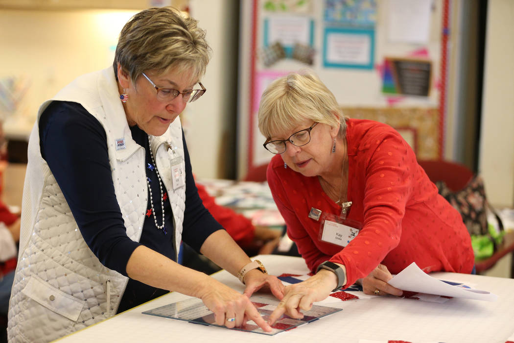 Hinde Socol, left, and Kay Drake, work on a pattern for a quilt during a meet by the Quilters f ...
