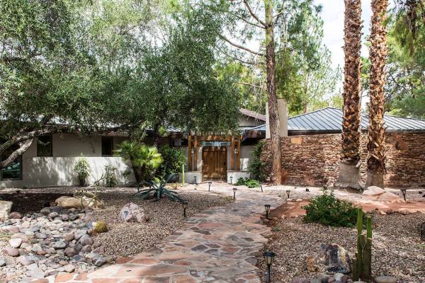 A stone path leads to the entrance to the main home. (Simply Vegas)