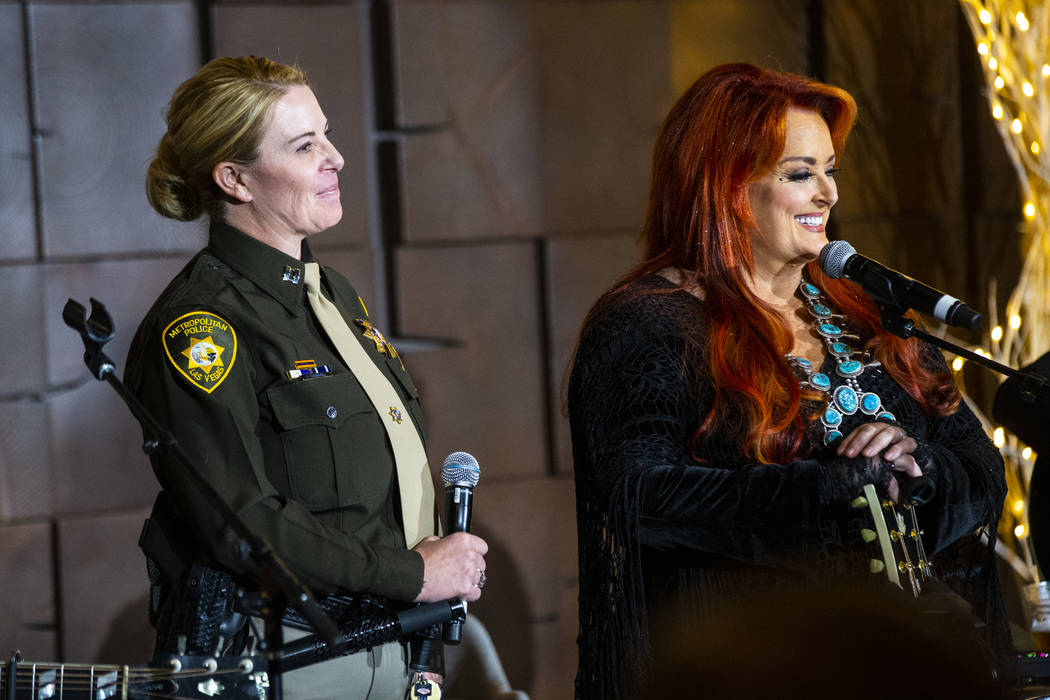 Metropolitan Police Department Capt. Kelly McMahill, left, performs with singer-songwriter Wyno ...