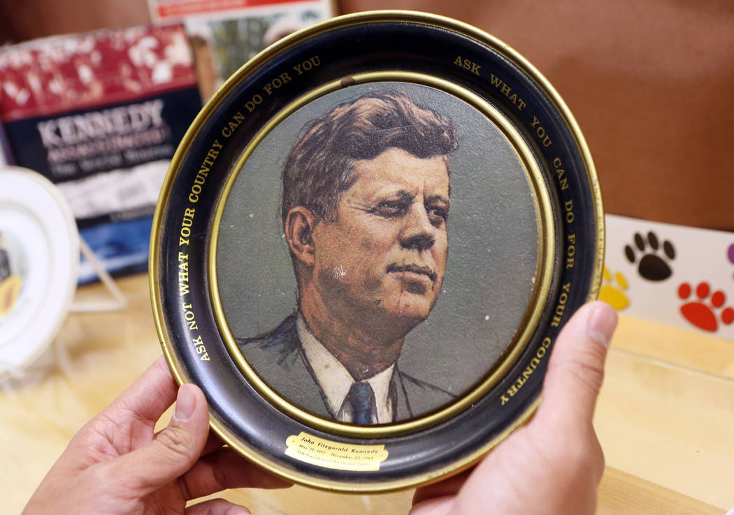 A vintage plate with U.S. President John F. Kennedy's inaugural address quote: "Ask not wh ...