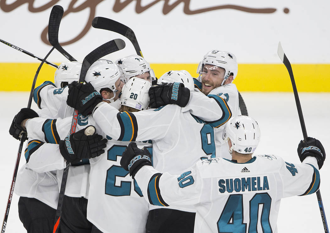 San Jose Shark players celebrate after beating the Vegas Golden Knights in overtime during thei ...
