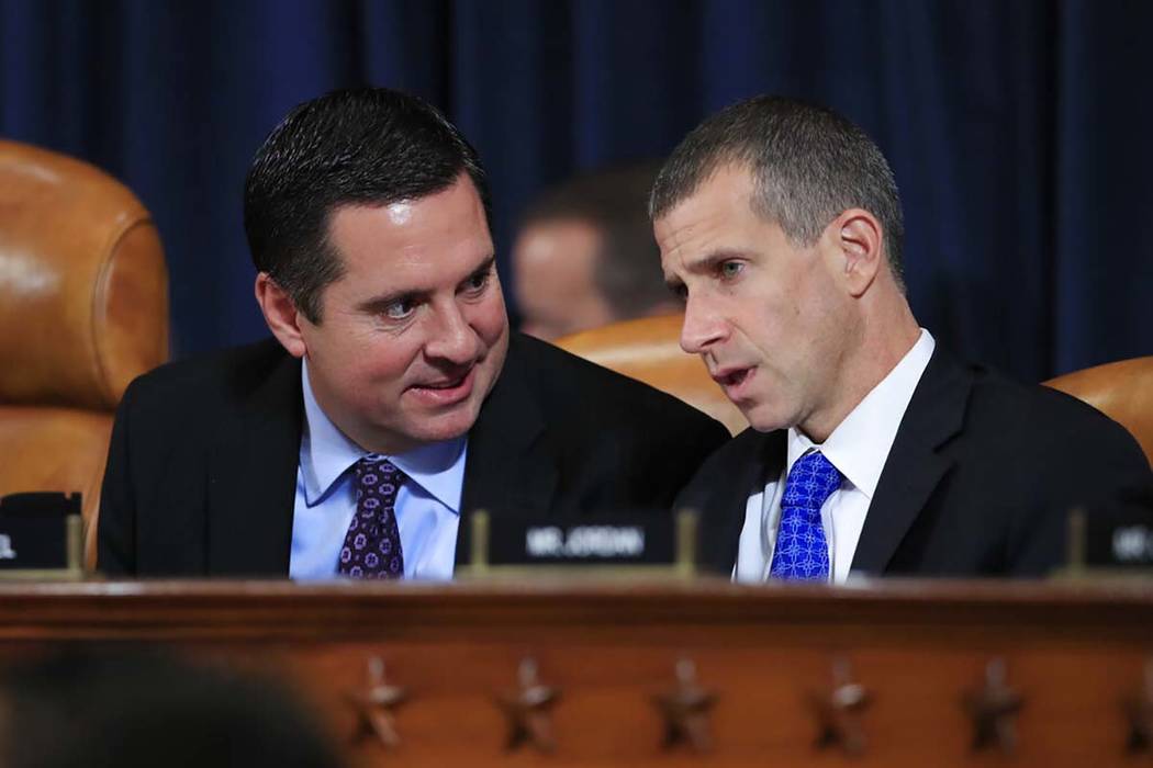 Rep. Devin Nunes, R-Calif, the ranking member of the House Intelligence Committee, talks with S ...