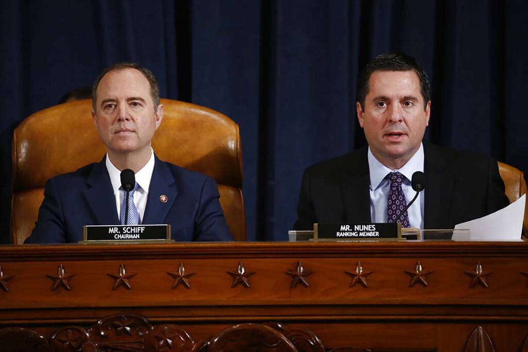 Rep. Devin Nunes, R-Calif., right, the ranking member of the House Intelligence Committee, join ...