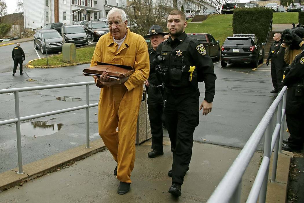 Former Penn State University assistant football coach Jerry Sandusky, left, arrives at the Cent ...