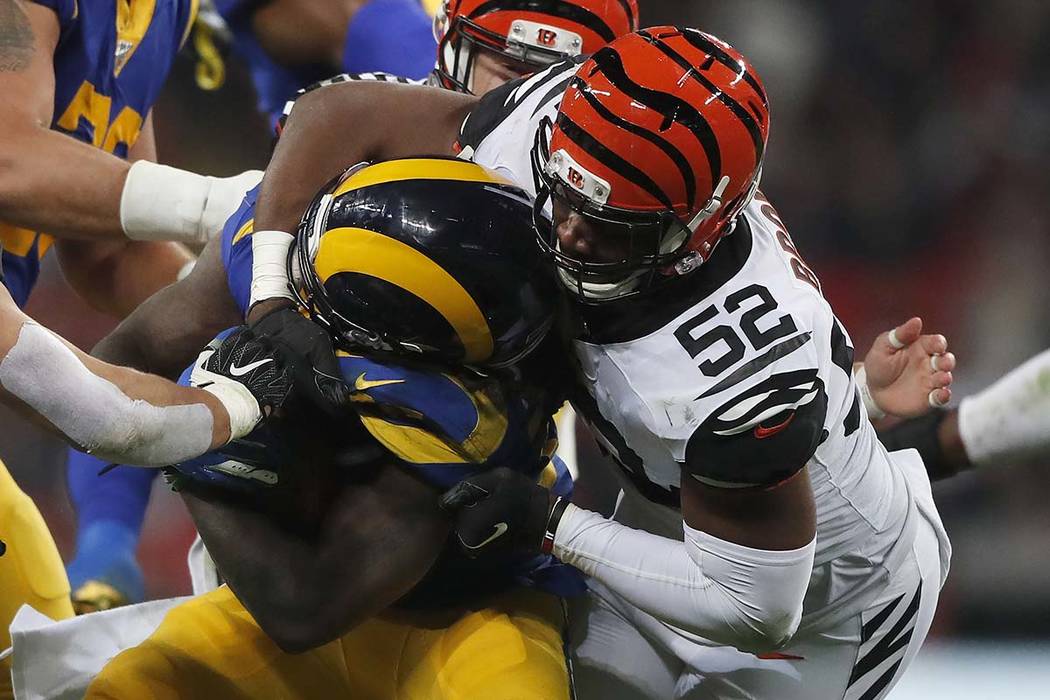 Cincinnati Bengals middle linebacker Preston Brown (52) tackles Los Angeles Rams running back D ...
