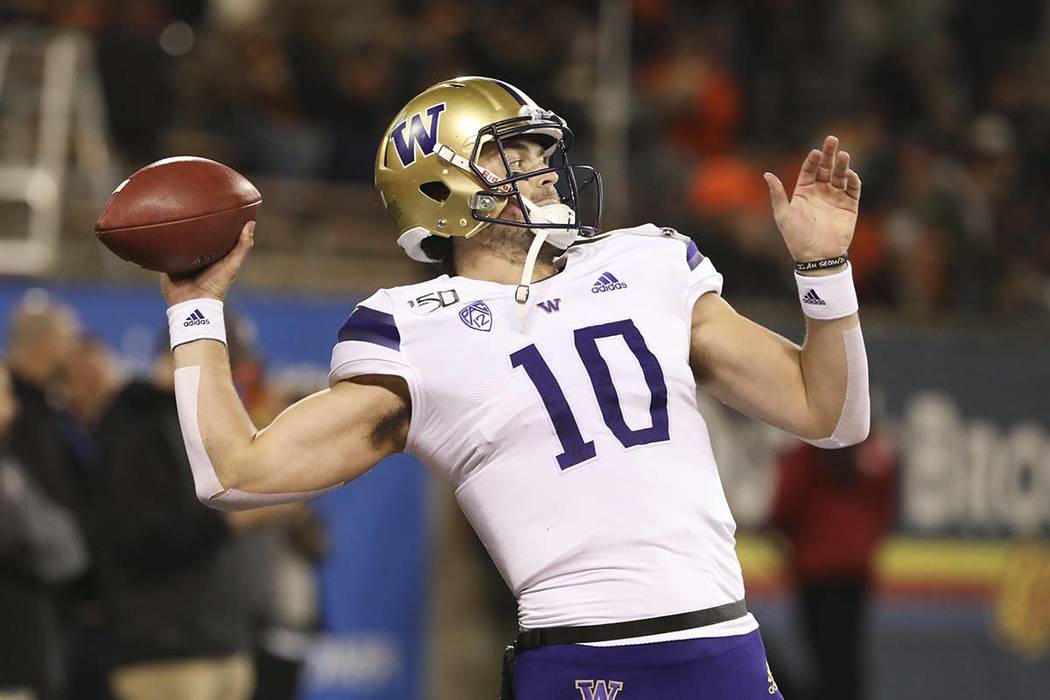 Washington quarterback Jacob Eason (10) warms up prior to the start of an NCAA college football ...