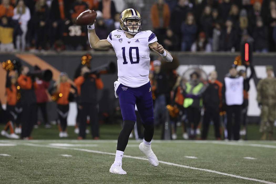 Washington quarterback Jacob Eason (10) looks for an open receiver during the second half of an ...