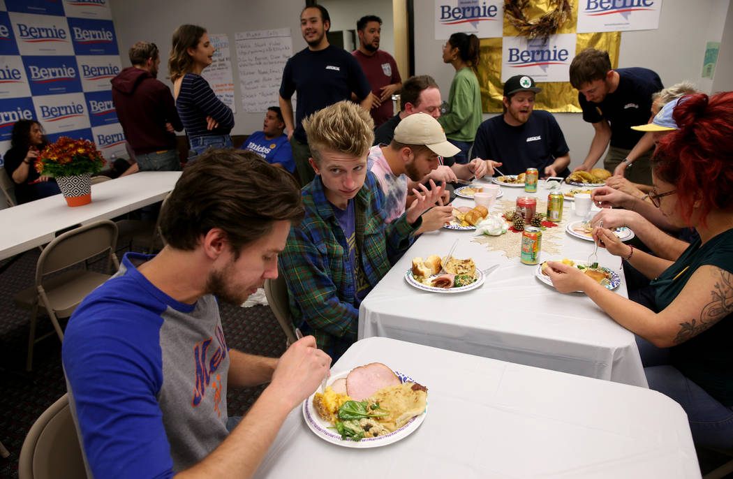 Campaign workers, including Andy Ryan of Las Vegas, left, and Hudson Villeneuve of Ypsilanti, M ...