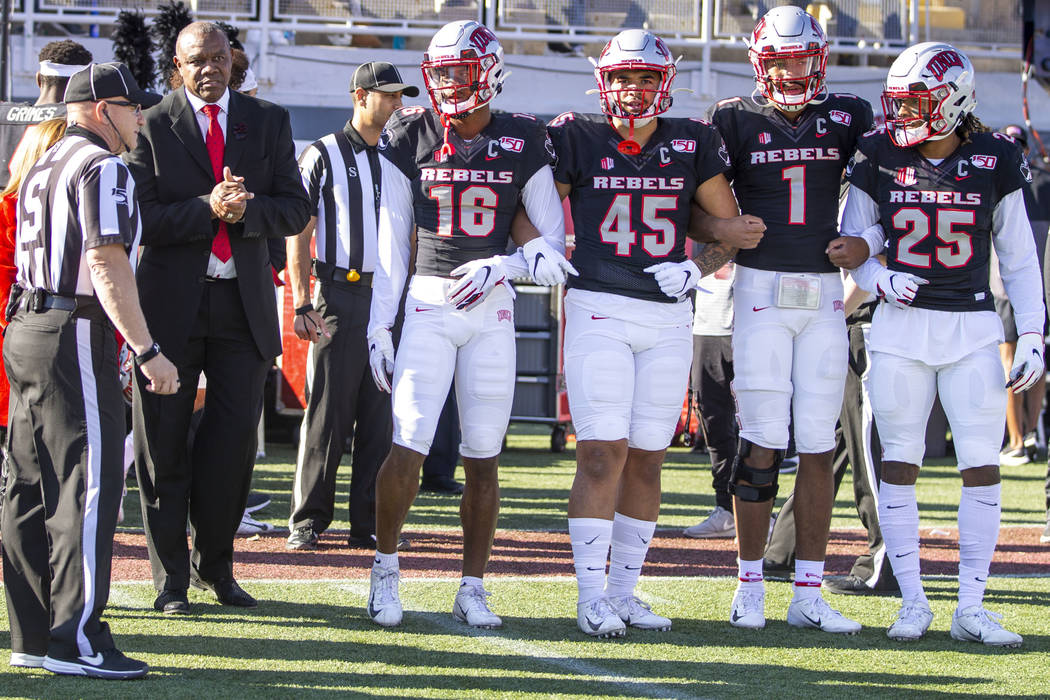 Former UNLV Rebels quarterback Randall Cunningham, center left, is ready to take the field with ...