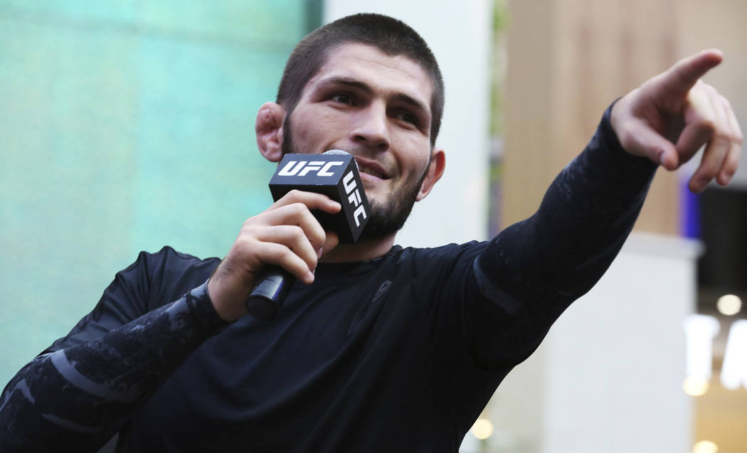 Russian UFC fighter Khabib Nurmagomedov gestures to the crowd during an open training session a ...