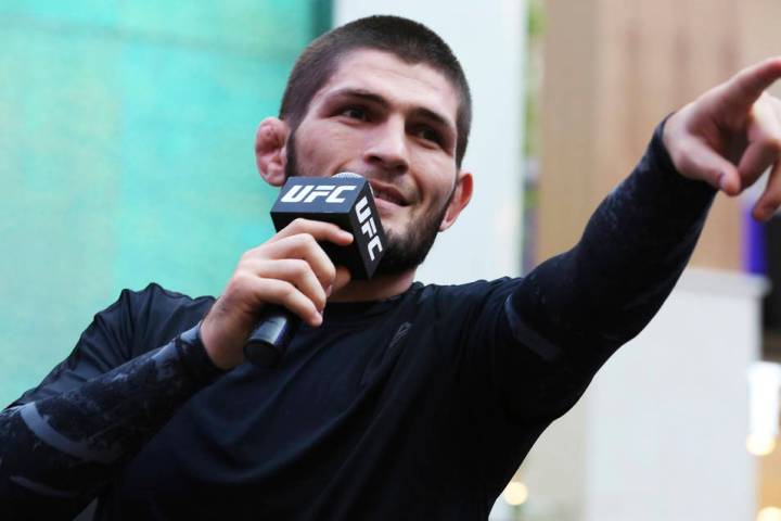 Russian UFC fighter Khabib Nurmagomedov gestures to the crowd during an open training session a ...