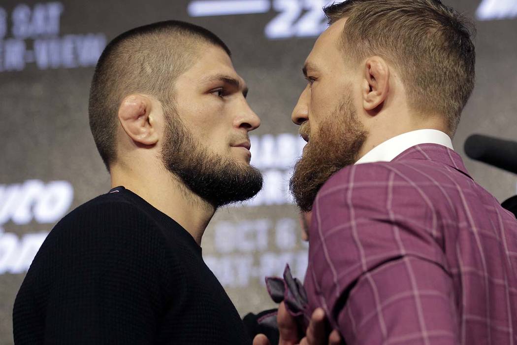 Conor McGregor, right, and Khabib Nurmagomedov pose for pictures during a news conference in Ne ...