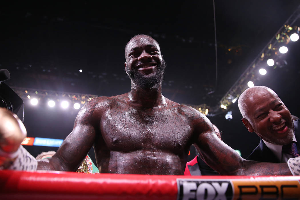Deontay Wilder celebrates after his knockout win against Luis Ortiz in the seventh round of the ...