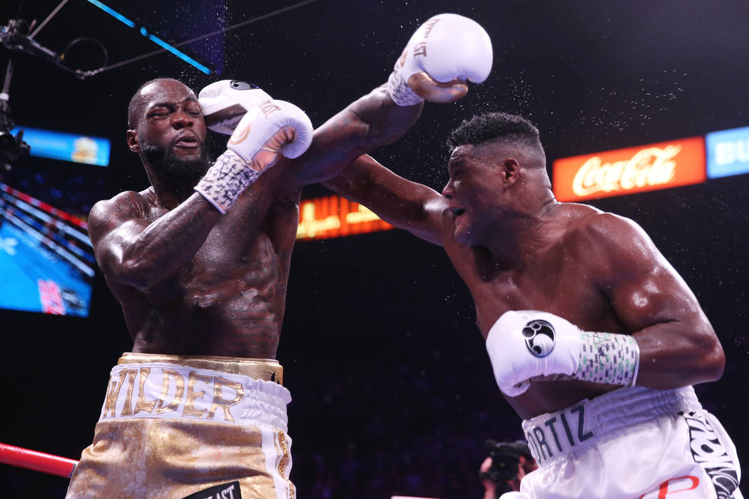 during the X round of the WBC heavyweight title bout at the MGM Grand Garden Arena in Las Vegas ...