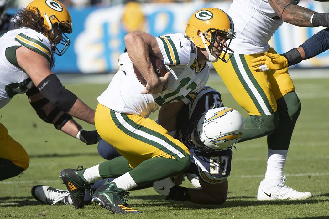 Los Angeles Chargers defensive end Joey Bosa, back, sacks Green Bay Packers quarterback Aaron R ...