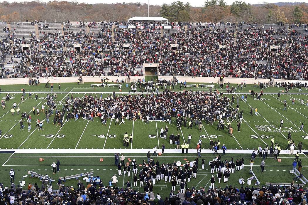 Demonstrators stage a climate change protest at the Yale Bowl delaying the start of the second ...