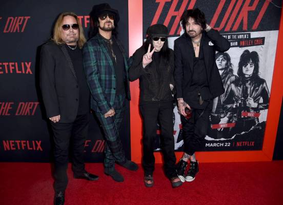 Vince Neil, from left, Nikki Sixx, Mick Mars and Tommy Lee, of Motley Crue, arrive at the world ...