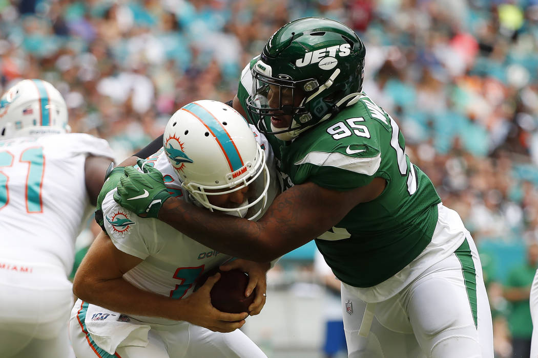 New York Jets defensive tackle Quinnen Williams (95) sacks Miami Dolphins quarterback Ryan Fitz ...