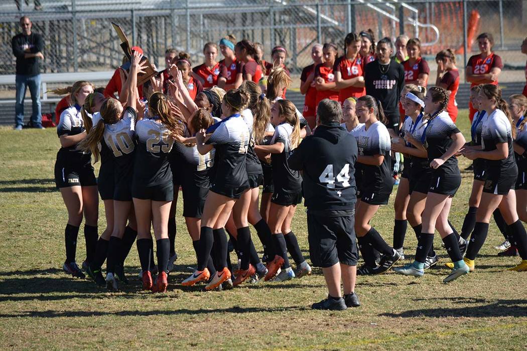 The Faith Lutheran girls soccer team celebrates the school's first-ever Class 4A state champion ...