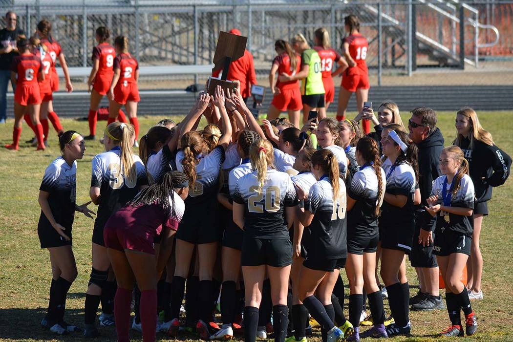 The Faith Lutheran girls soccer team celebrates the school's first-ever Class 4A state champion ...