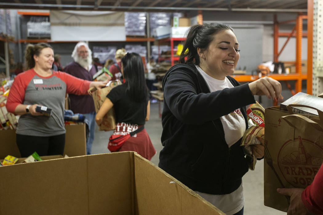 Jessica Wood, a volunteer from Southern Glazer's Wine and Spirits, hands out powdered mashed po ...