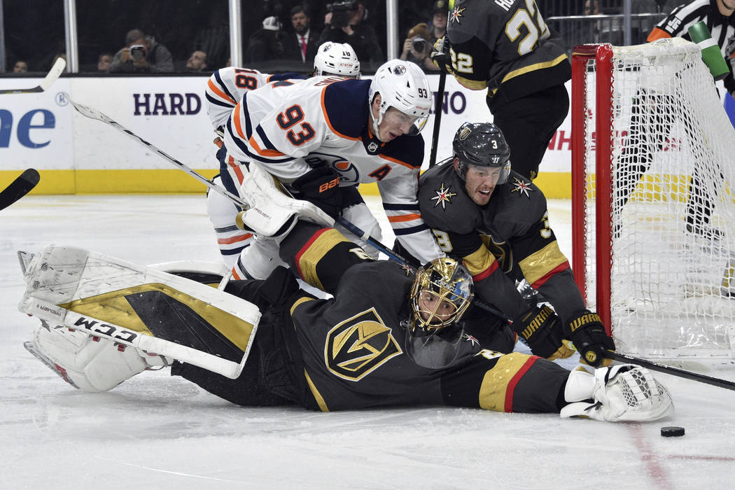 Vegas Golden Knights goaltender Marc-Andre Fleury (29) and defenseman Brayden McNabb (3) defend ...