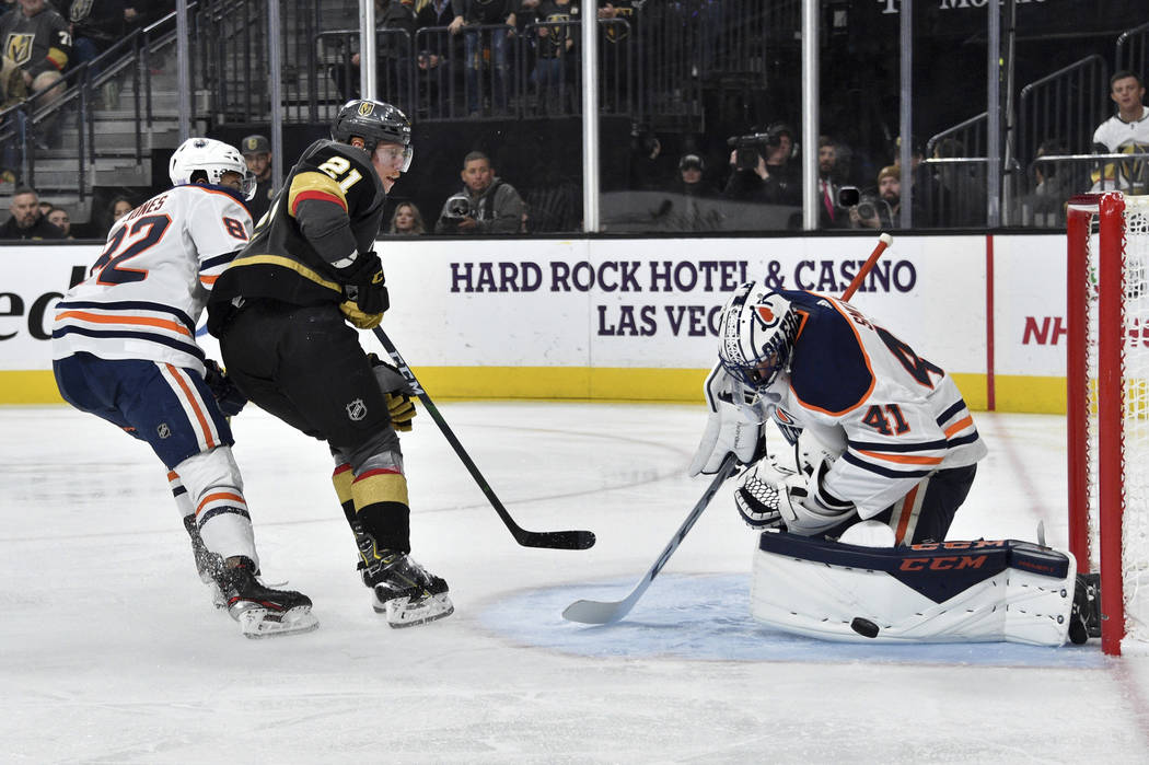 Vegas Golden Knights center Cody Eakin (21) shoots again Edmonton Oilers goaltender Mike Smith ...