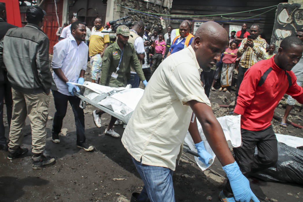 Rescuers remove bodies from the debris of an aircraft operated by private carrier Busy Bee whic ...