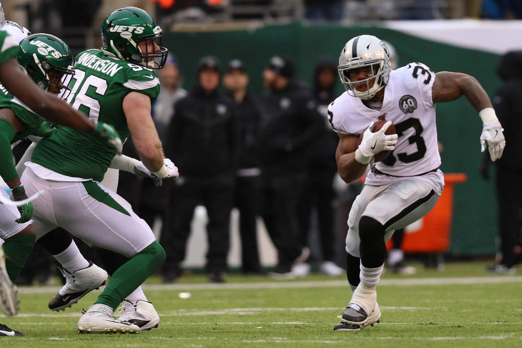 Oakland Raiders running back DeAndre Washington (33) runs with the football as New York Jets de ...