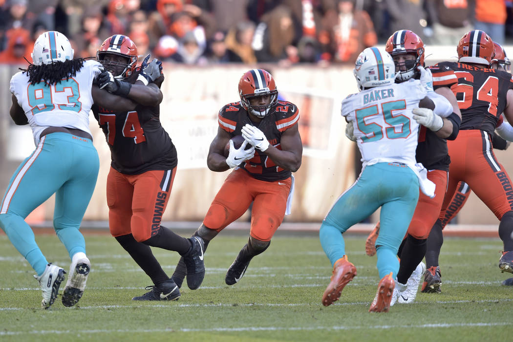 Cleveland Browns running back Nick Chubb (24) rushes during the second half of an NFL football ...