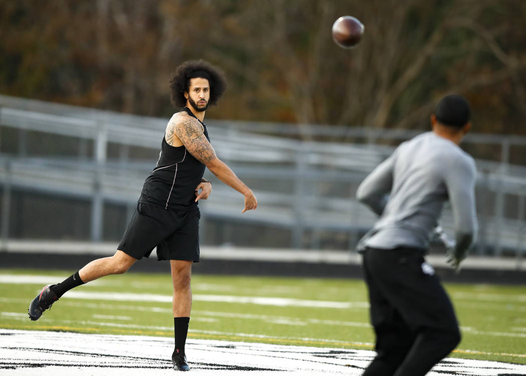 Free agent quarterback Colin Kaepernick participates in a workout for NFL football scouts and m ...