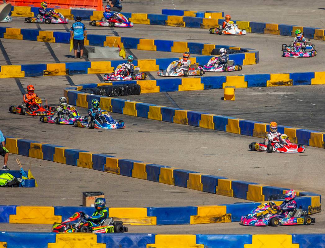 The X30 Masters fight for position on the track during the SKUSA SuperNationals at the Rio on S ...