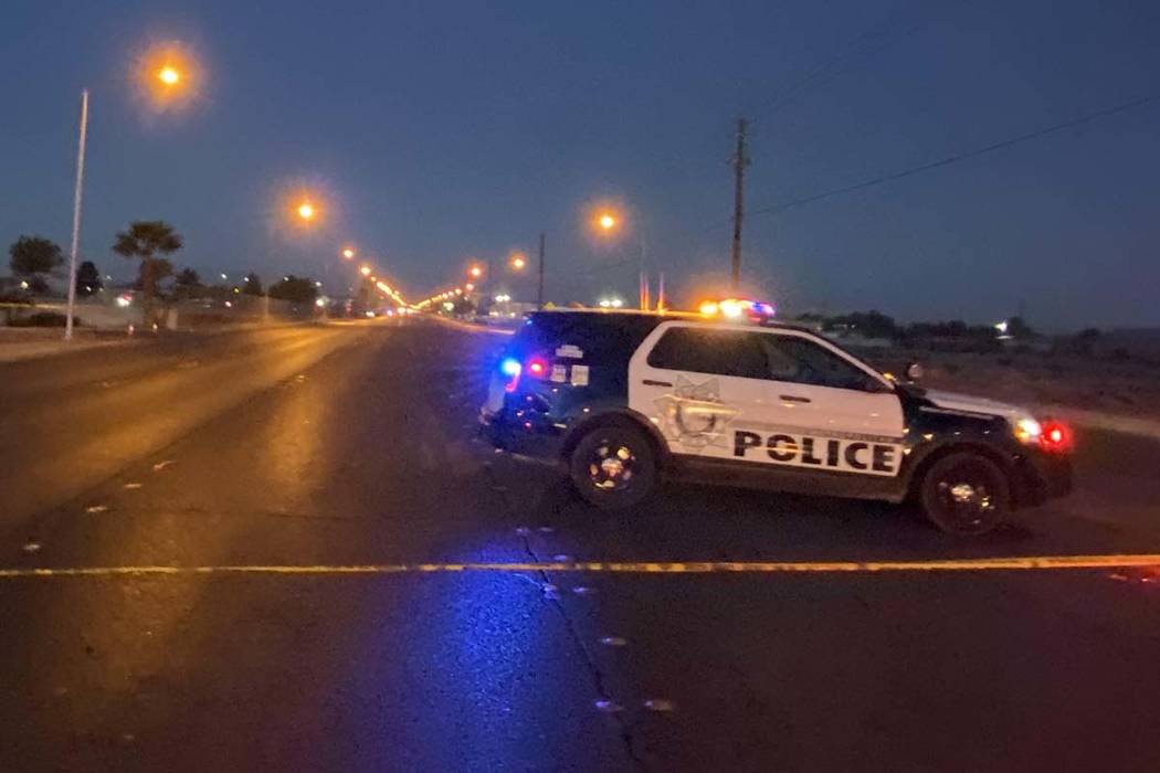 Crime scene tape and a Las Vegas Metropolitan Police Department squad vehicle block East Lake M ...