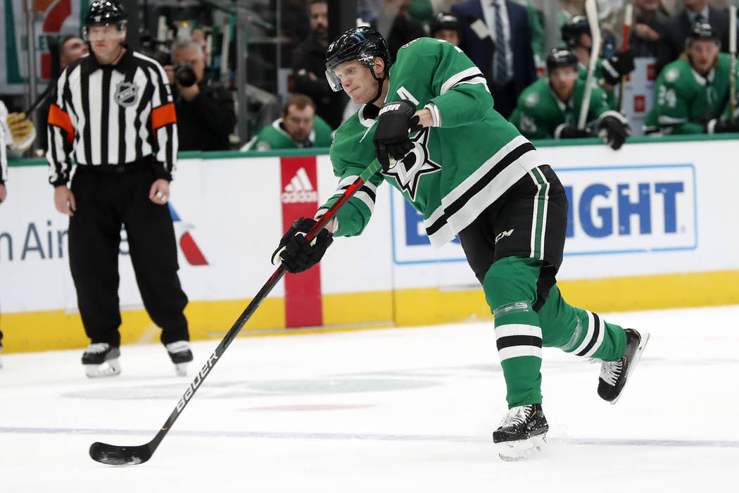 Dallas Stars defenseman John Klingberg (3) takes a shot at the net that was redirected by Alexa ...