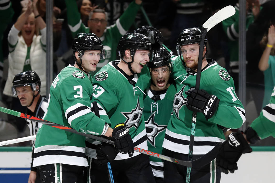 Dallas Stars' John Klingberg (3), Esa Lindell, Andrew Cogliano (11) and Radek Faksa, right, cel ...