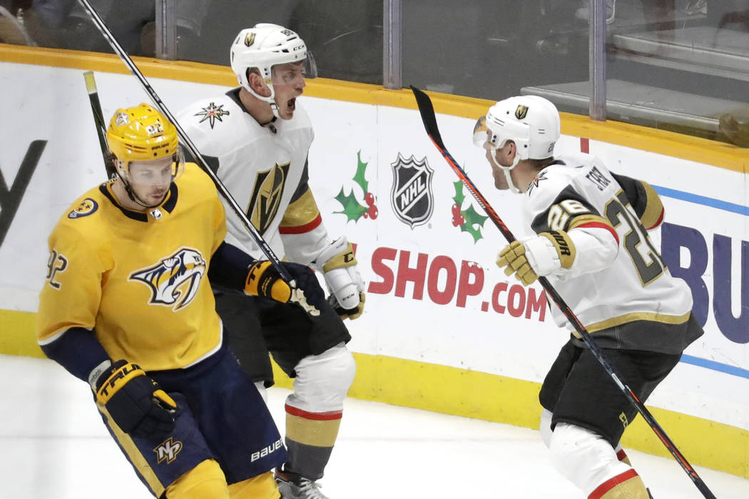 Vegas Golden Knights center Paul Stastny (26) celebrates with Nate Schmidt (88) after Stastny s ...