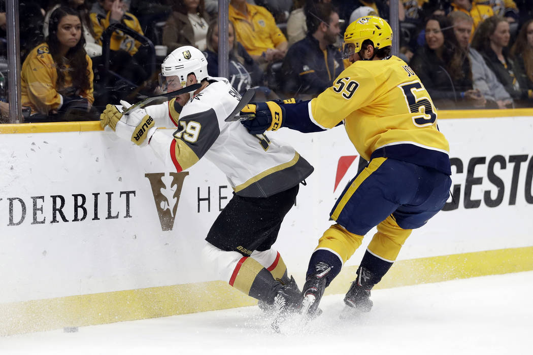 Nashville Predators defenseman Roman Josi (59), of Switzerland, checks Vegas Golden Knights rig ...