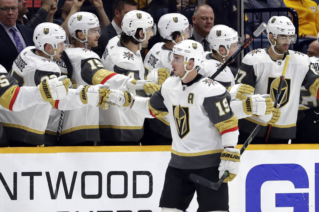 Vegas Golden Knights right wing Reilly Smith (19) is congratulated after scoring a goal against ...