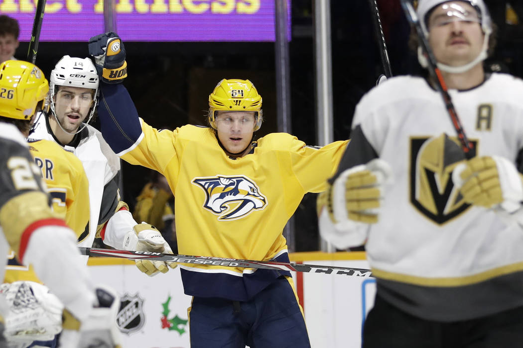 Nashville Predators center Mikael Granlund (64), of Finland, celebrates after scoring a goal ag ...