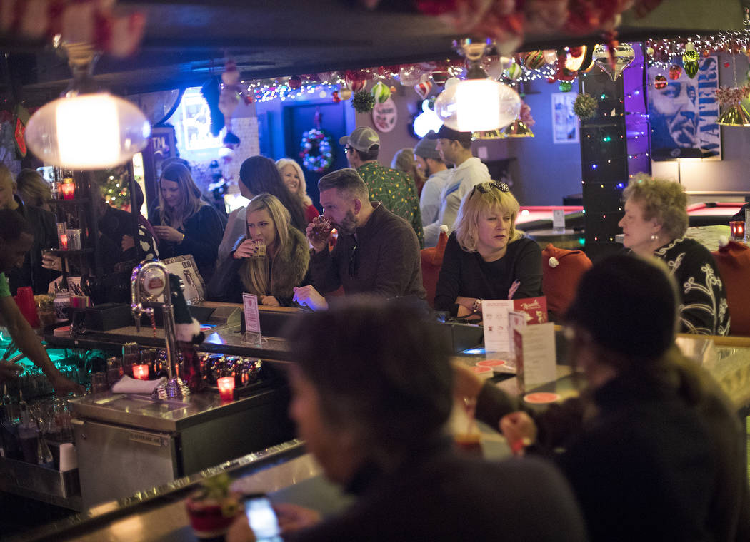 Guests at the bar of the Sand Dollar Lounge in Las Vegas, Monday, Nov. 25, 2019. The bar is hos ...