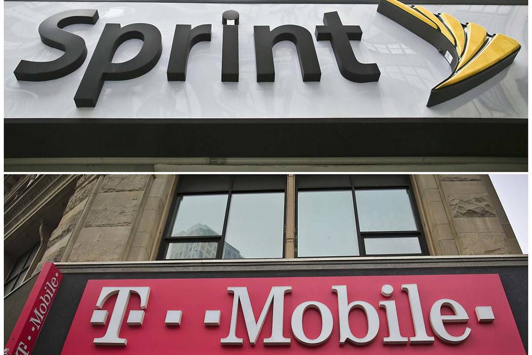 A combination of April 30, 2018, file photos shows signage for a Sprint store in New York's Her ...