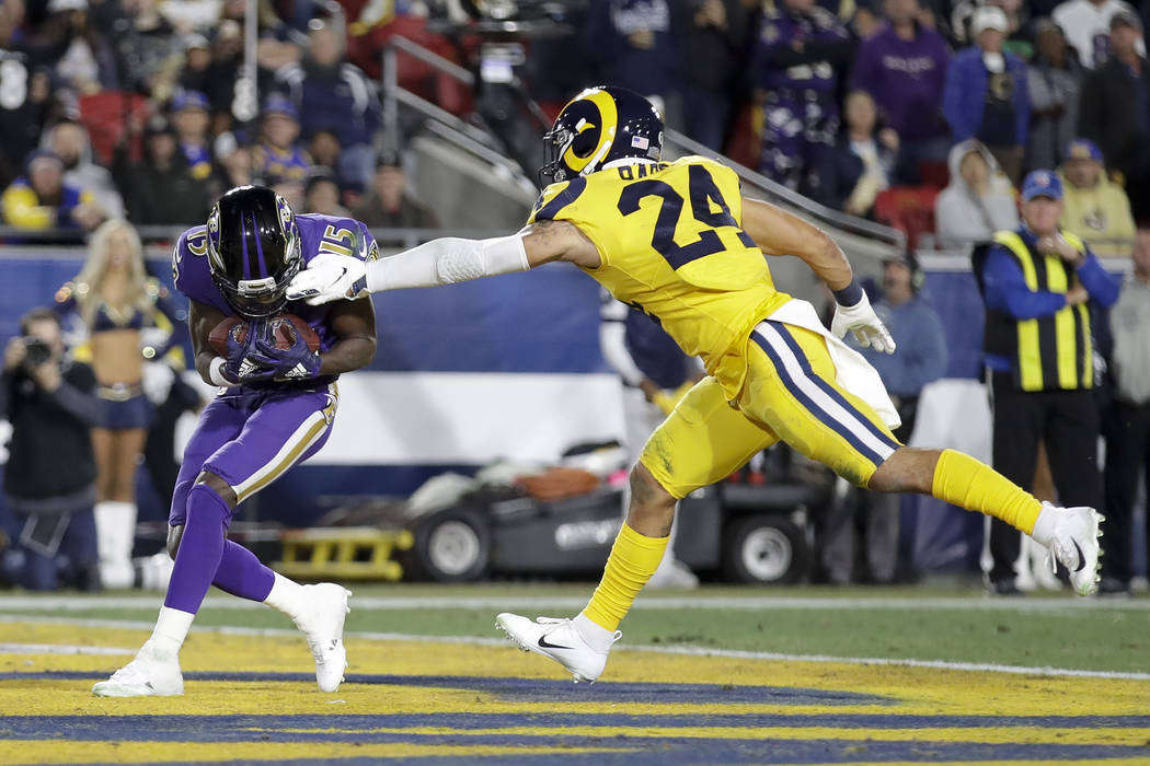 Baltimore Ravens wide receiver Marquise Brown scores past Los Angeles Rams safety Taylor Rapp d ...