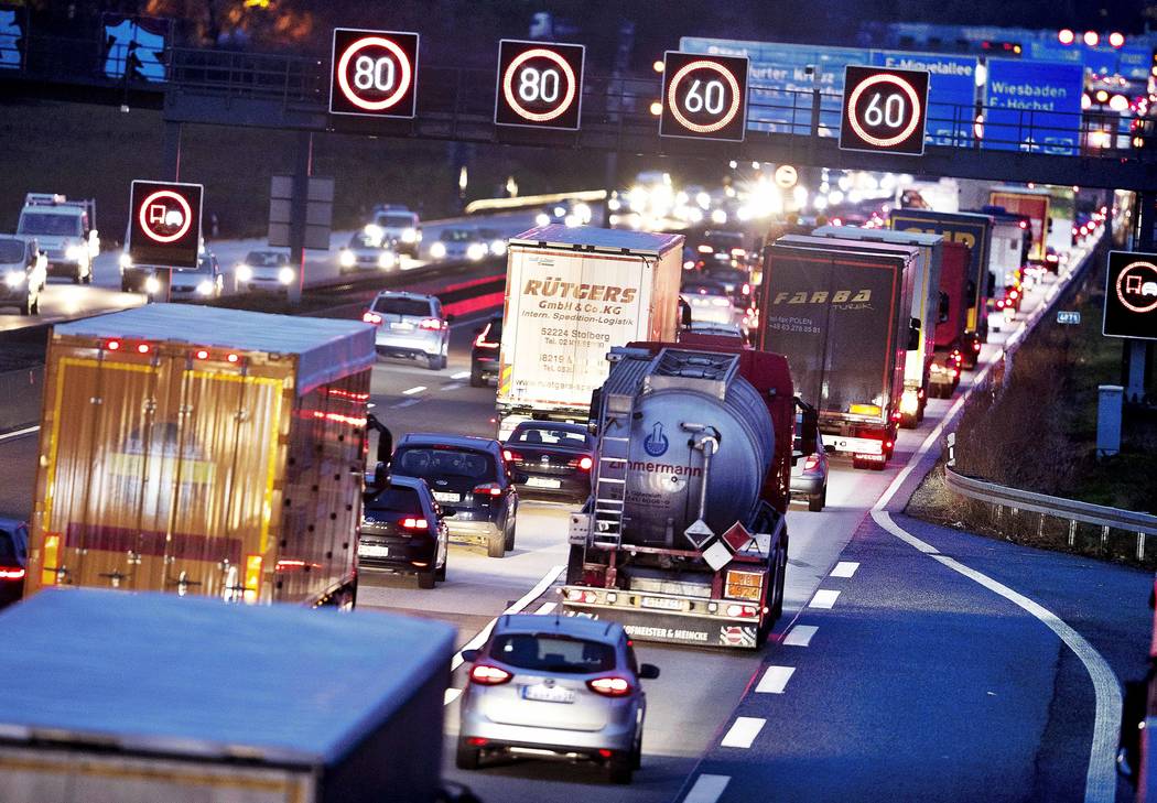FILE - In this Tuesday, Dec. 4, 2018 file photo, Trucks line up on a highway in Frankfurt, Germ ...