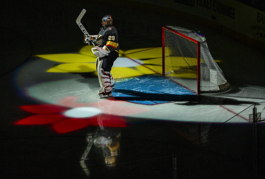 Vegas Golden Knights goaltender Marc-Andre Fleury (29) stands amongst flowers on the ice during ...