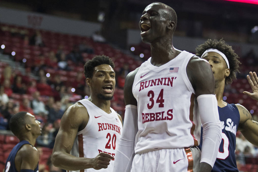 UNLV Rebels forward Cheikh Mbacke Diong (34) celebrates after scoring and getting fouled by Jac ...