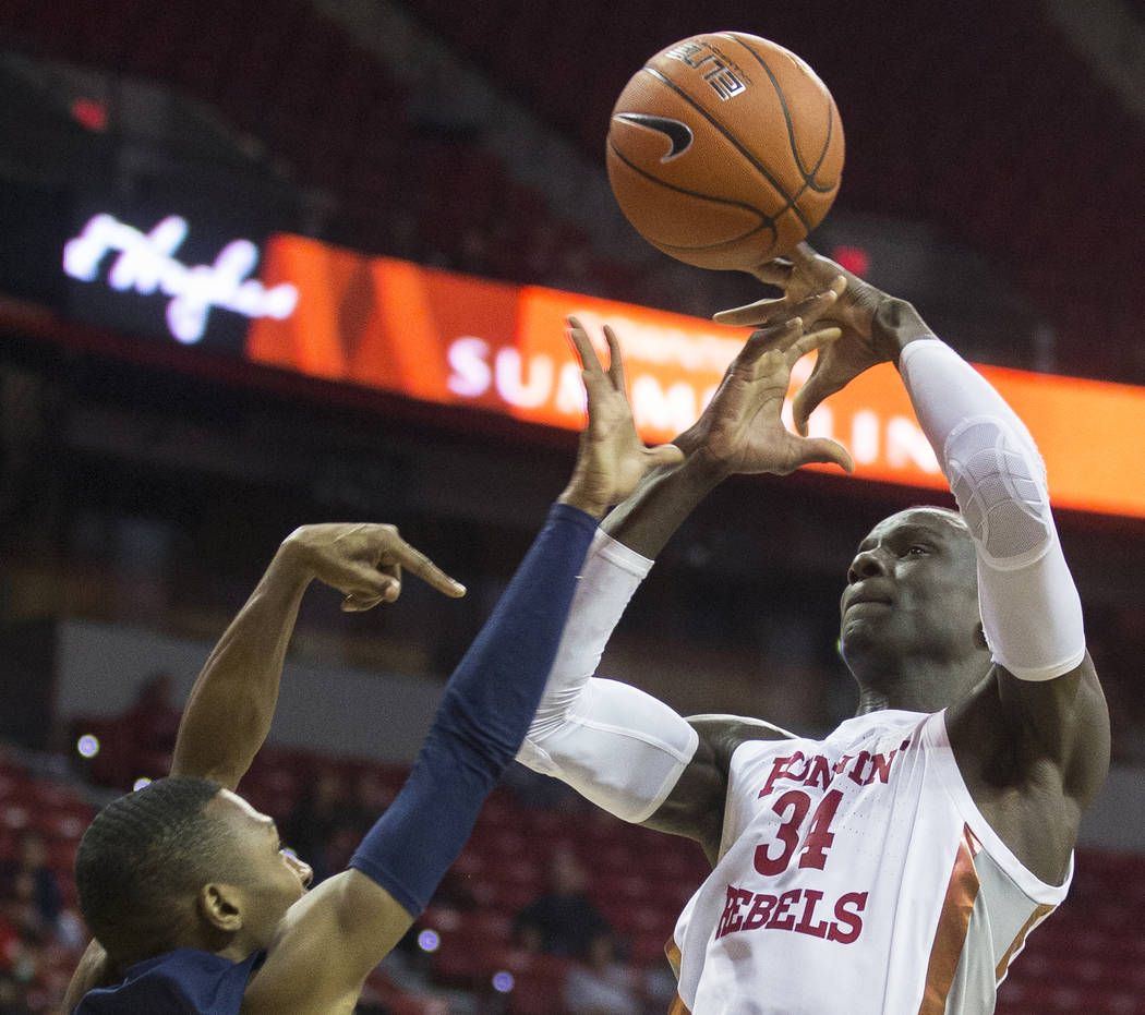 UNLV Rebels forward Cheikh Mbacke Diong (34) is fouled on the way to the rim by Jackson State T ...