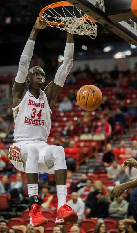 UNLV Rebels forward Cheikh Mbacke Diong (34) dunks in the second half during their NCAA basketb ...